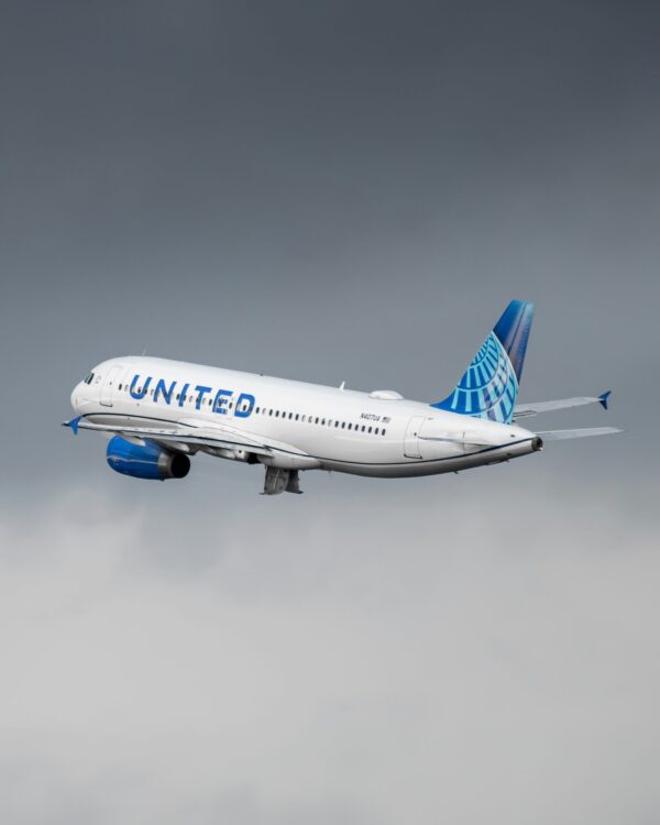 United Airline plane in a gray sky